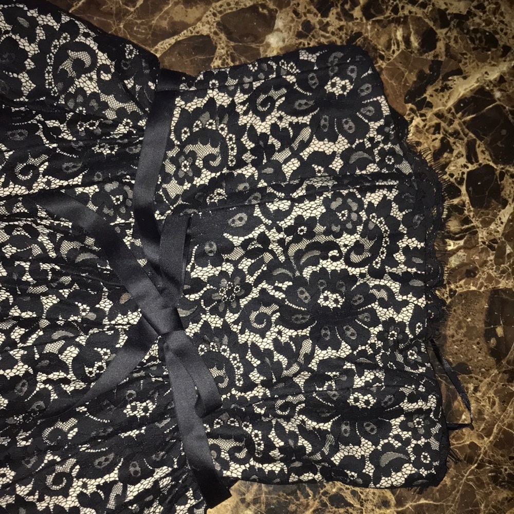 This is a black size 4 only worn once thigh length dress.